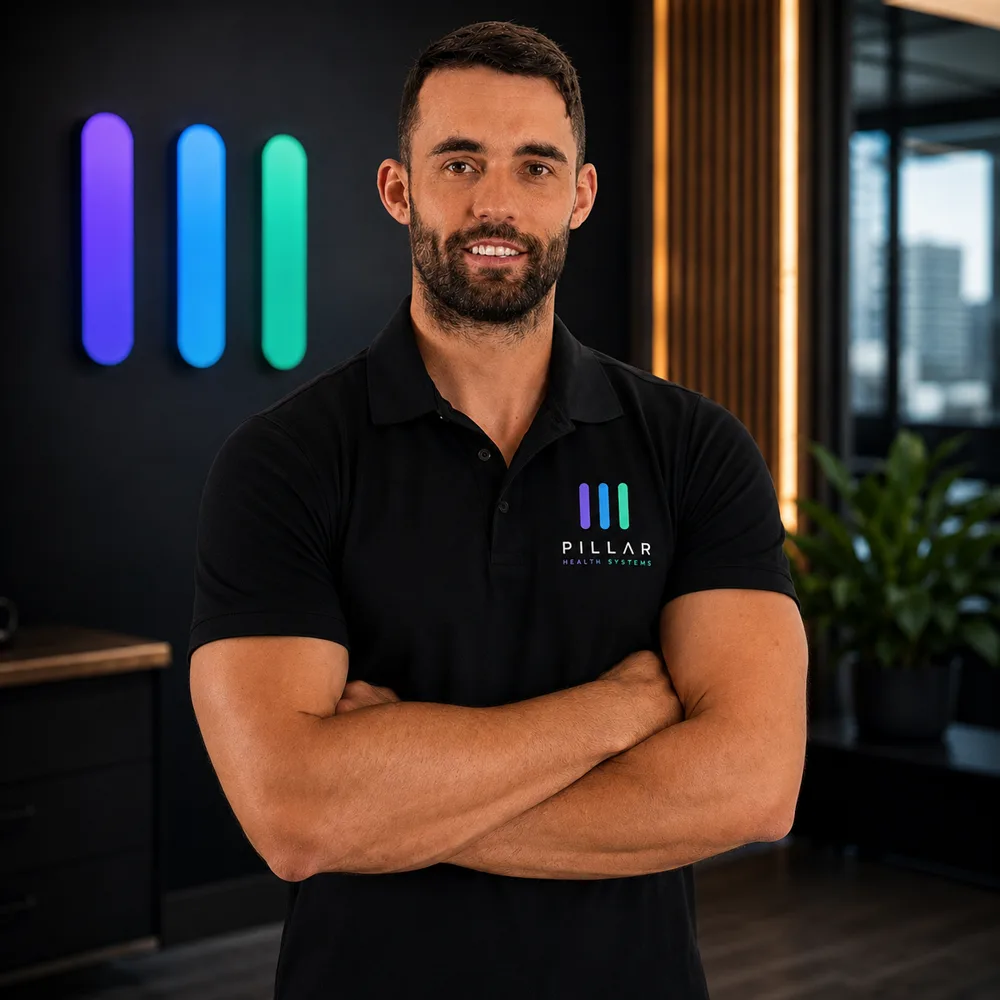 Dr Jason Colvin, Co-Founder and Chief Executive Officer of Pillar, photographed in an allied health clinic consulting room.